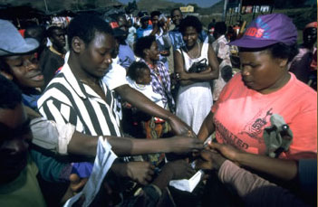 An AIDS worker distributing free condoms