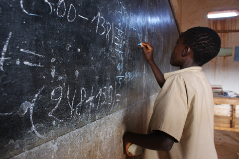A young boy solving an equation at a primary school in Makamba, in southern Burundi