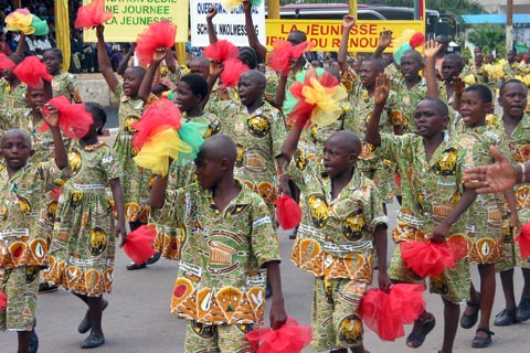 School children march in celebrations marking Cameroon’s 50th anniversary