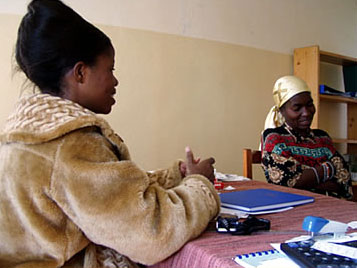A psychologist (left) counsels a Congolese rape survivor