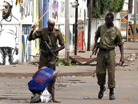 Soldiers beating a civilian in Togo