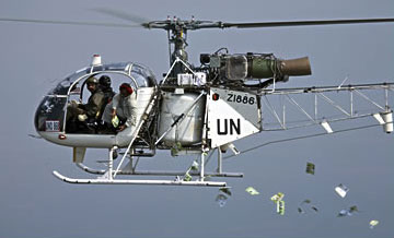 A UN helicopter drops leaflets in an area of the Congo