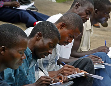 Job seekers filling out applications in Monrovia, Liberia