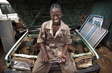 A young woman professionally trained as an auto mechanic in Kenya