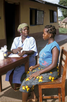 A pregnant woman gets medicine and advice at a rural clinic in Kenya