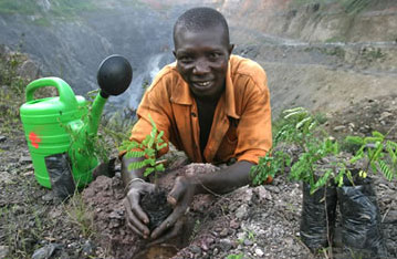 Planting new trees near a manganese mine in Ghana