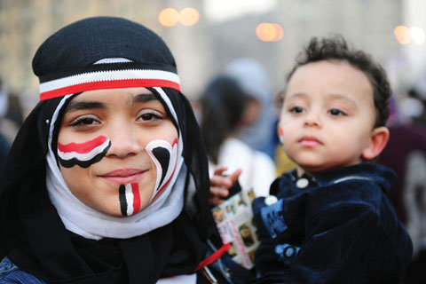 Egyptians in Cairo's Tahrir Square celebrate the fall of the Mubarak government