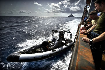 A relief ship delivering food to Somalia is protected by a Dutch warship