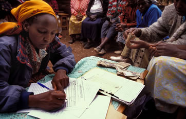 Signing up for a loan with a community group’s microcredit programme in Kenya