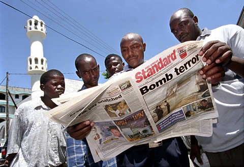 A day after bombings in Mombasa, Kenya, in 2002, against Israeli-linked targets, residents outside one of the city’s mosques read a newspaper for details of the attack, which was claimed by Al-Qaida.