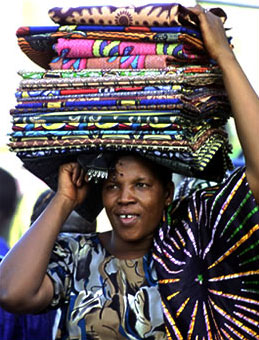 A market trader in Bamako, Mali, selling African-made textiles