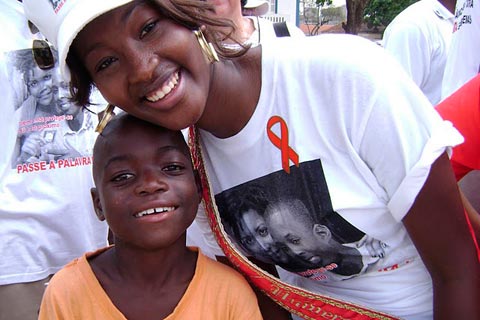 Miss Angola with a child during an AIDS solidarity event in Angola.