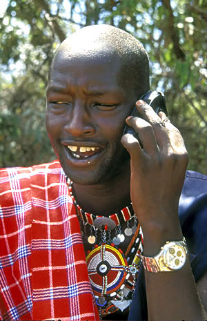 Young Kenyan using mobile phone.