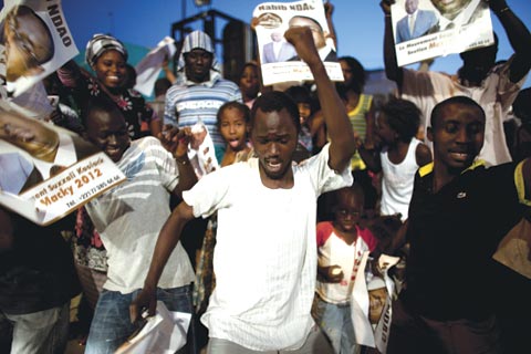 Residents of Dakar celebrate the election of a new president