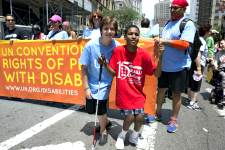 Image of Team UN with CRPD banner at first-ever Disability Pride Parade in New York City, 12 July 2015