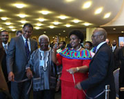 Ms. Nkoana-Mshsabane cutting the ribbon to open 'Nelson Mandela: Man of the People,' with Dr. Magubane (at left) and South African Permanent Representative to the UN Baso Sangqu (at right)  © UN Photo/Bo Li