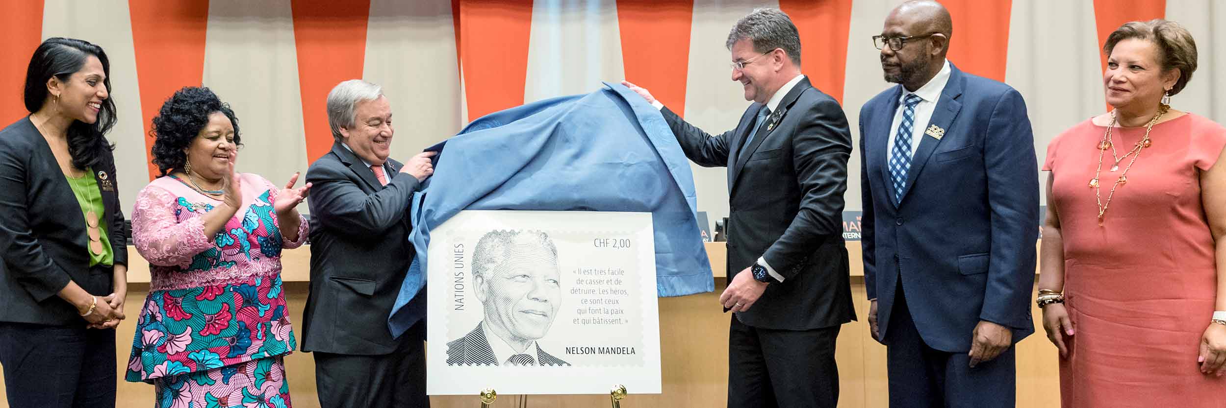 Secretary-General António Guterres (centre left) and Miroslav Lajčák (centre right), President of the 72nd session of the General Assembly, unveil a new stamp on the occasion of Nelson Mandela International Day. Mr. Guterres and Mr. Lajčák are joined for the unveiling by (left to right): Penny Abeywardena, Commissioner of NYC; Edna Molewa, Minister of Environmental Affairs of South Africa; Forest Whitaker, UNESCO Special Envoy for Peace and Reconciliation and SDG Global Advocate; and Catherine Pollard, Under-Secretary-General for General Assembly and Conference Management. © UN Photo/Rick Bajornas