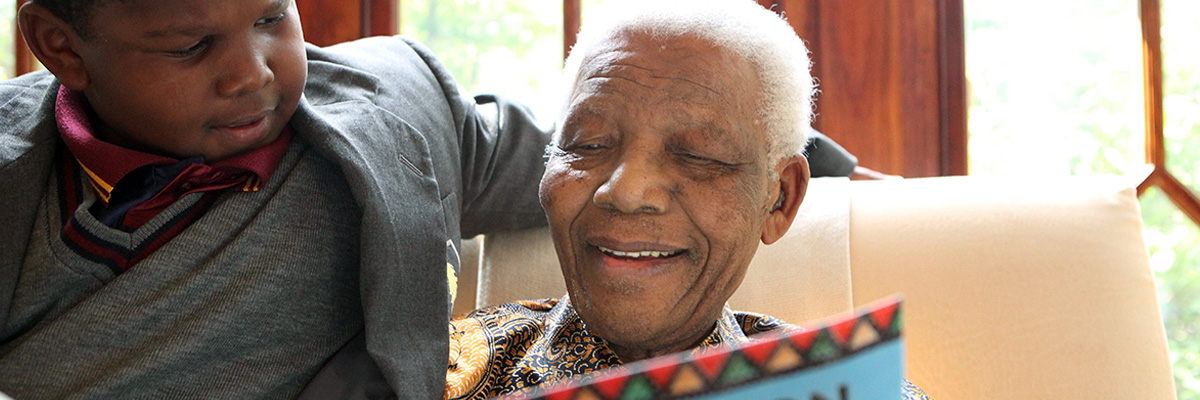 Mandela reading with his great grandson, Ziyanda Manaway, the Children’s Version of Long Walk to Freedom. 2009. NMF Photo/Debbie Yazbek