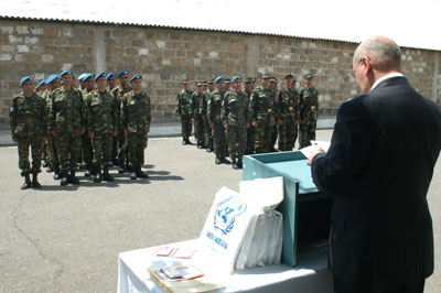 "UN DPI Representative, UN RC a.i. Mr. Valeri Tkatchouk, reading out the SG message for the soldiers and the audience. 