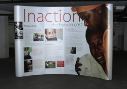 large scale poster titled: Inaction - The Human Cost