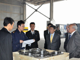 At Tianjin port, photo of Chinese Customs Officers explaining their procedures for examining cargo to Ambassador Oh Joon (centre), Chair of the 1540 Committee, during the Committee's visit to China on 23 and 24 October 2014.