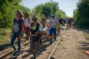 During her journey from Greece to Germany in 2015, Yusra (left) traveled through Hungary with other asylum-seekers.  © UNHCR/Lam Duc Hien