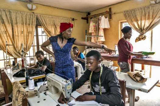 Fashion designer Ejiro A. Tafiri, 28, and her team in their workshop in Lagos, Nigeria. Photo: Panos/A. E.