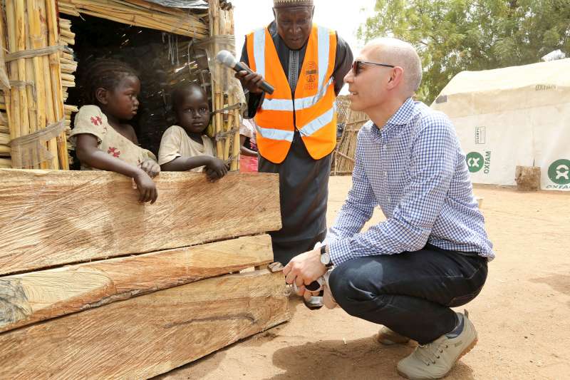 UN Assistant High Commissioner for Protection Volker Türk talks to displaced Nigerian children in Malkohi host community, Yola, Nigeria.
