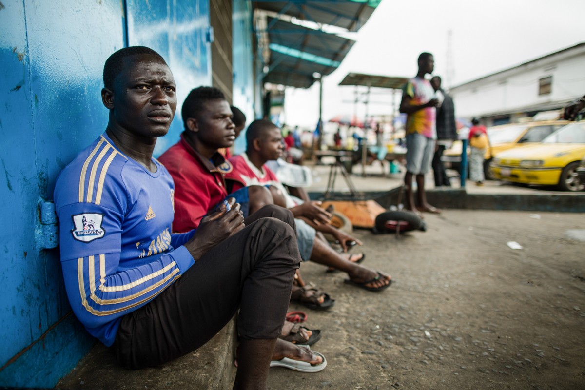 Unemployed taxi drivers during the Ebola crisis, Liberia 2014. The COVID-19 crisis threatens to disproportionately hit developing countries–Income losses are expected to exceed $220 billion.