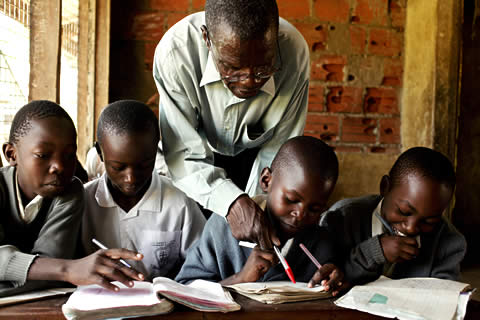 Teacher and students in a classroom.