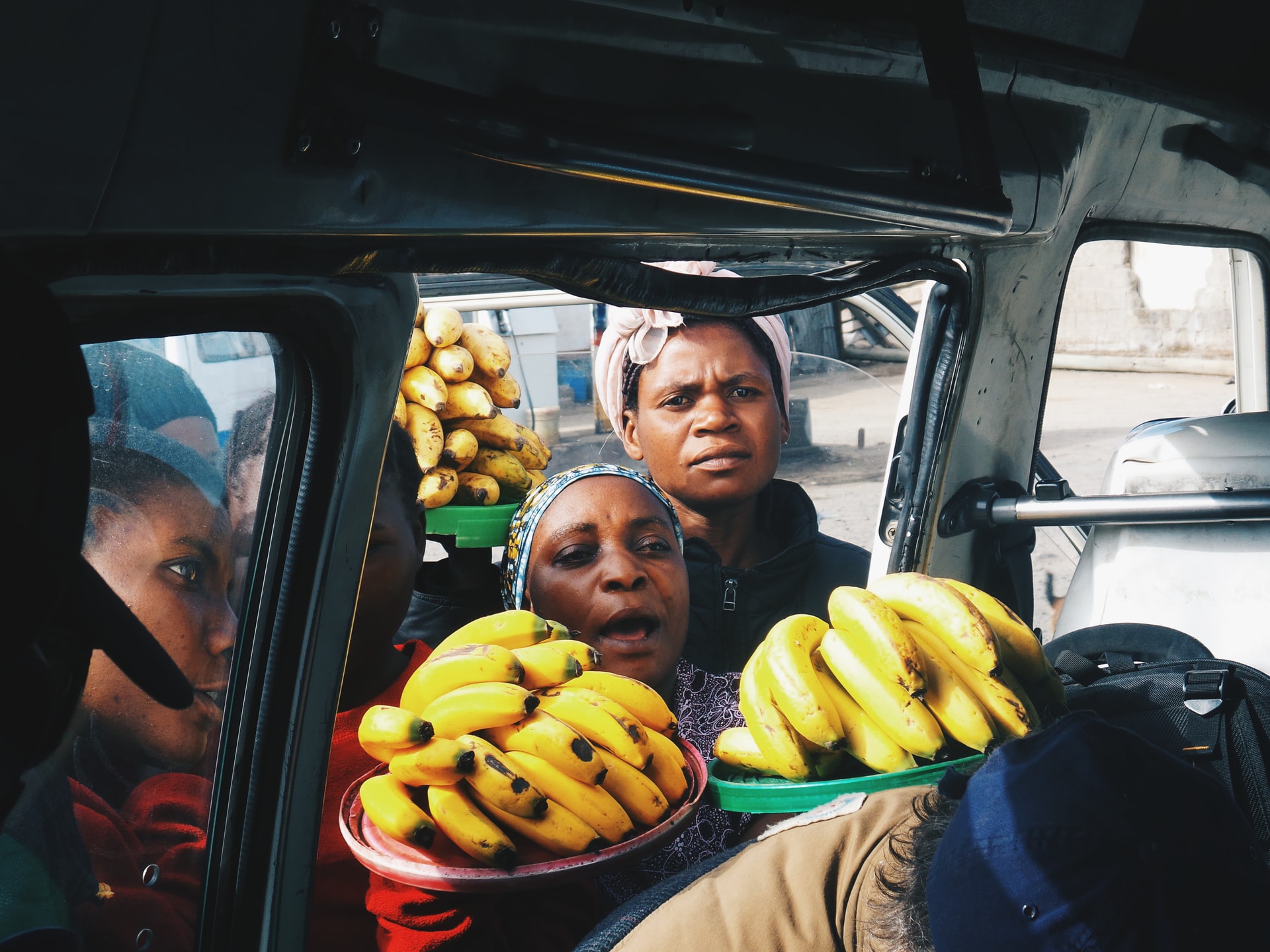 Tanzanian women selling bananas in tanzania.