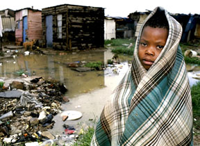 Child in a shanty town