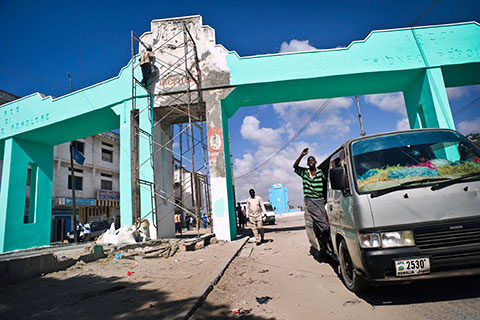 Repainting an historical arch inMogadishu