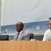 Mr. Ephraim Mwepya Shitima of Zambia, at center, between two other meeting participants.