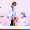 Nigerian President Muhammadu Buhari receives a dose of COVID-19 vaccine in Abuja, Nigeria.