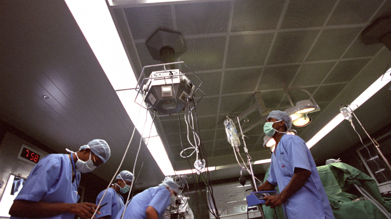  Surgeons in the operating theatre at a Bangalore hospital, Bangalore , India. Photo credit: Panos/B. Lawley