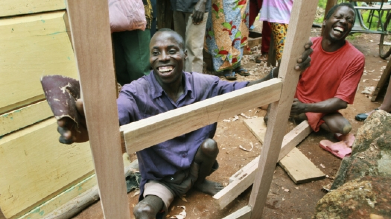 Jonathan Bigirima (left), married and father of six, in his joinery. Photo: Panos/D. Telemans