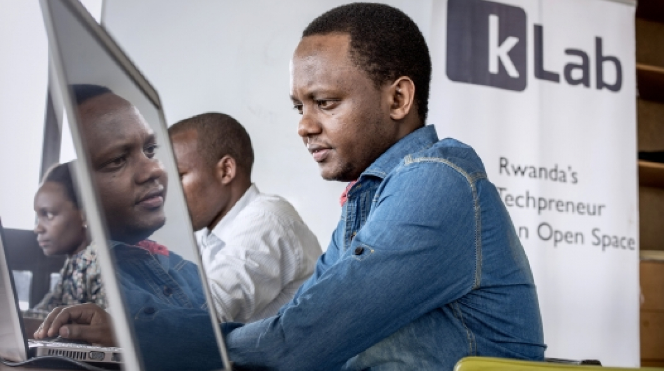 Youth working on laptop computers at K Lab (Knowledge Lab), an open technology hub in Kigali, Rwanda.     Panos/Sven Torfinn