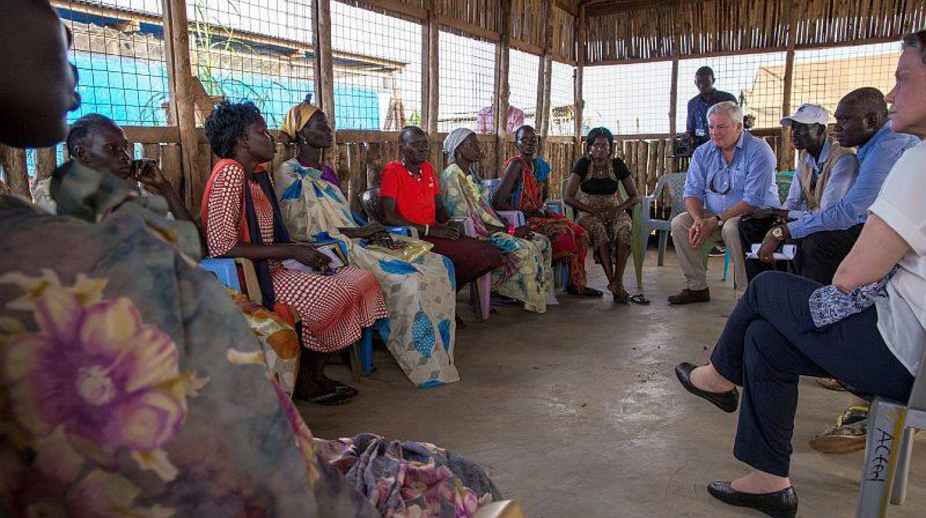 UN Emergency Relief Coordinator Stephen O'Brien (top, centre), on a visit to South Sudan, meets with women representatives in the Protection of Civilians site 3, in the capital Juba. Photo: UNMISS/JC McIlwaine