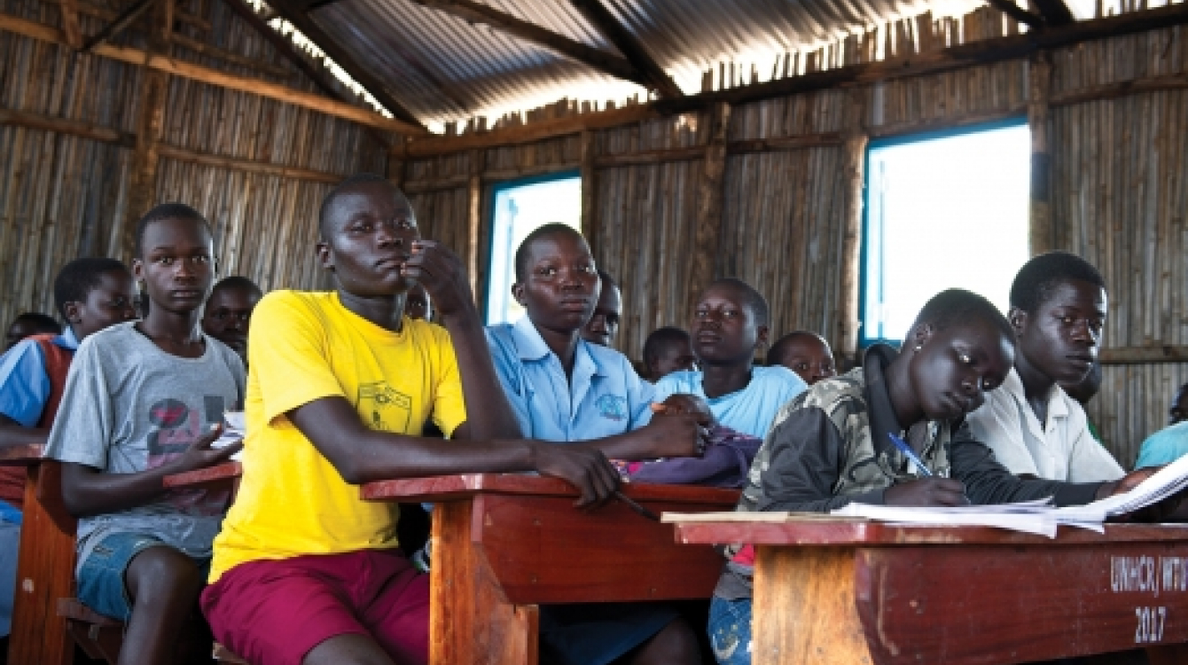 Refugee students in a classroom in Uganda. Photo: UN Photo/Mark Garten