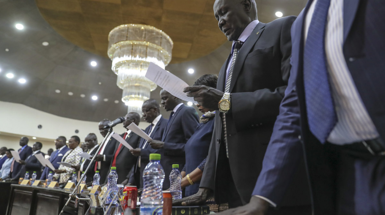 Oath of office in one hand, the other on a Bible or Quran as 35 ministers and ten deputies were sworn into South Sudan's new cabinet on 16 March.