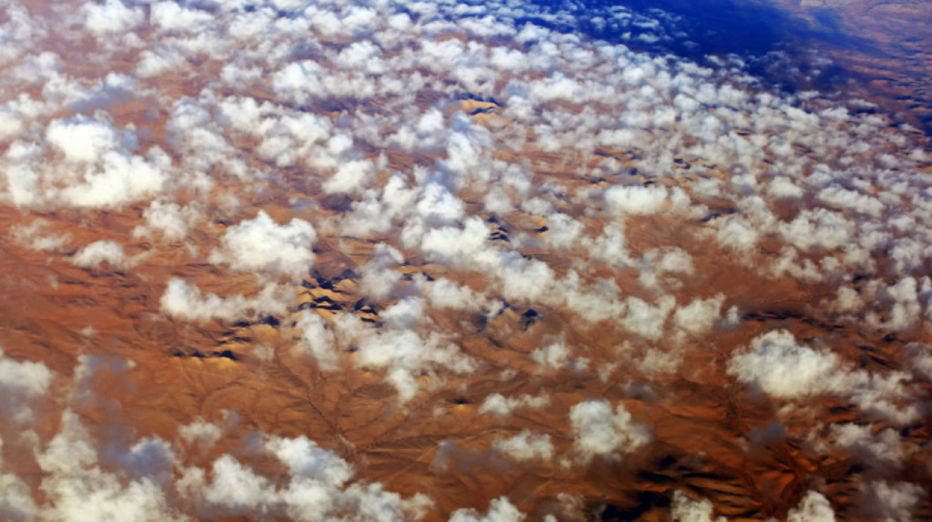 Clouds over the desert in southern Libya. Deserts form a large part of the country and human settlements are mostly found around oases. Photo Credits: Lason Athanasiadis/UNSMIL