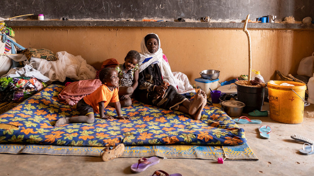 A displaced family from a village in Mali was relocated to a former school.