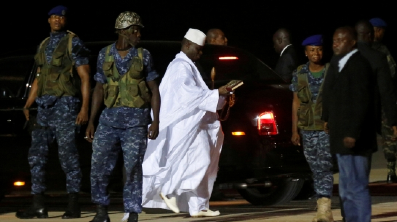 The Gambia’s former president Yahya Jammeh (in white) prepares to depart from Banjul airport to exile in Guinea Bissau on January 21, 2017. Photo: Reuters/Thierry Gouegnon