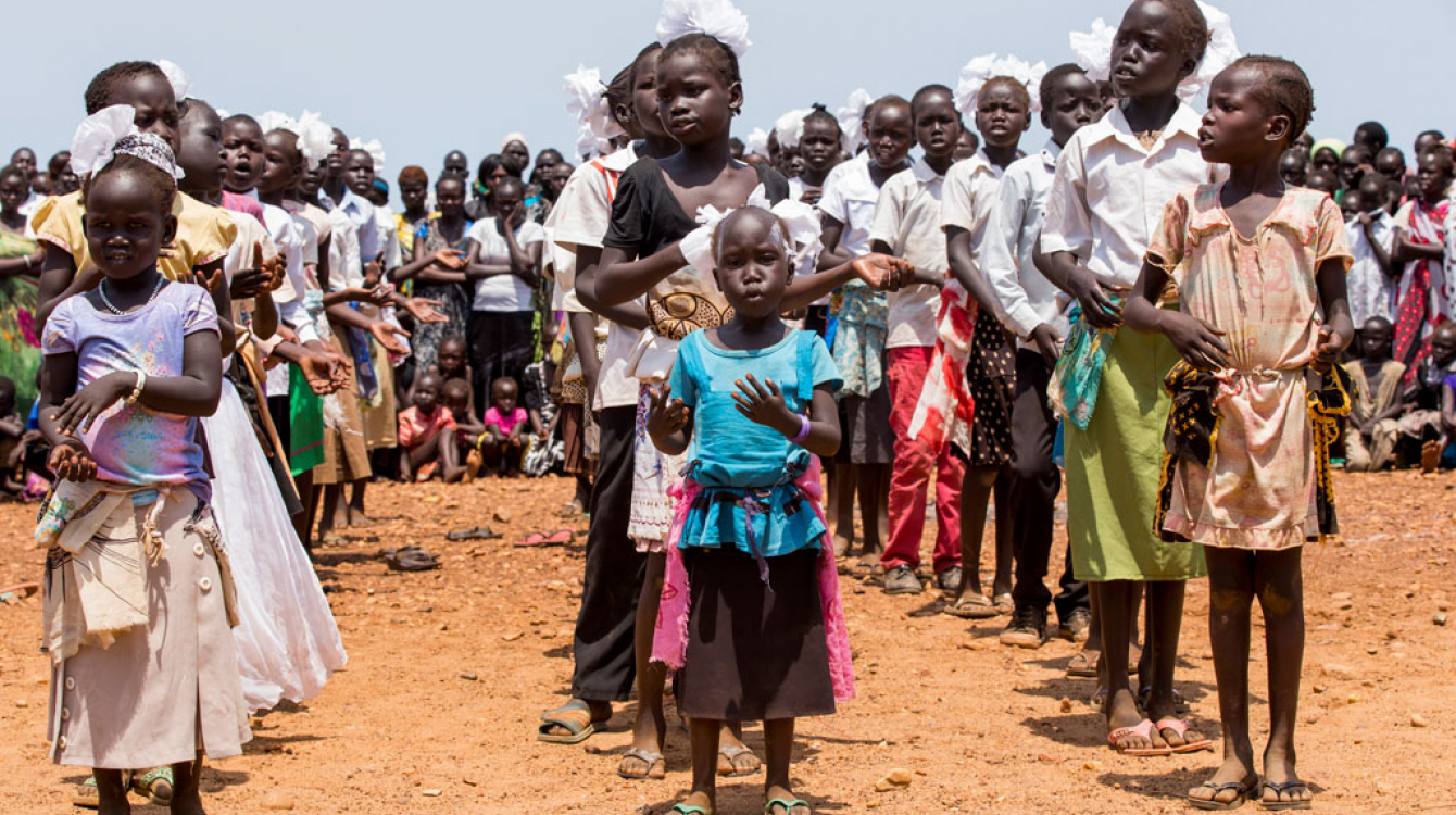Children at a protection of civilians site in Juba, South Sudan, run by the UN Mission, perform at a special cultural event in March 2015. UN Photo/JC McIlwaine
