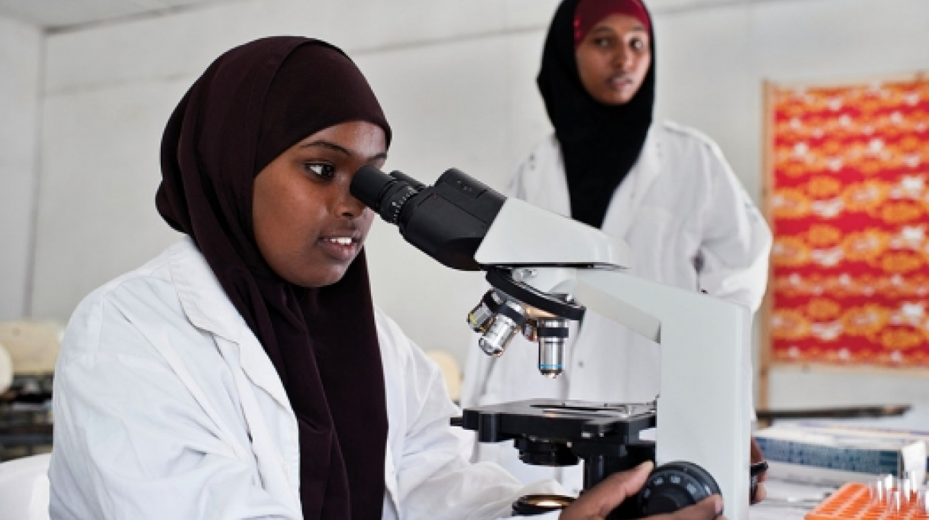 Young women study in a science laboratory at Mogadishu University, Somalia. Photo: Panos/Sven Torfinn