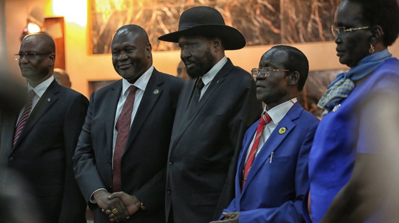 President Salva Kiir holding hands with his First Vice President Riek Machar and three of his four Vice Presidents. The fourth VP was appointed on 23 February.