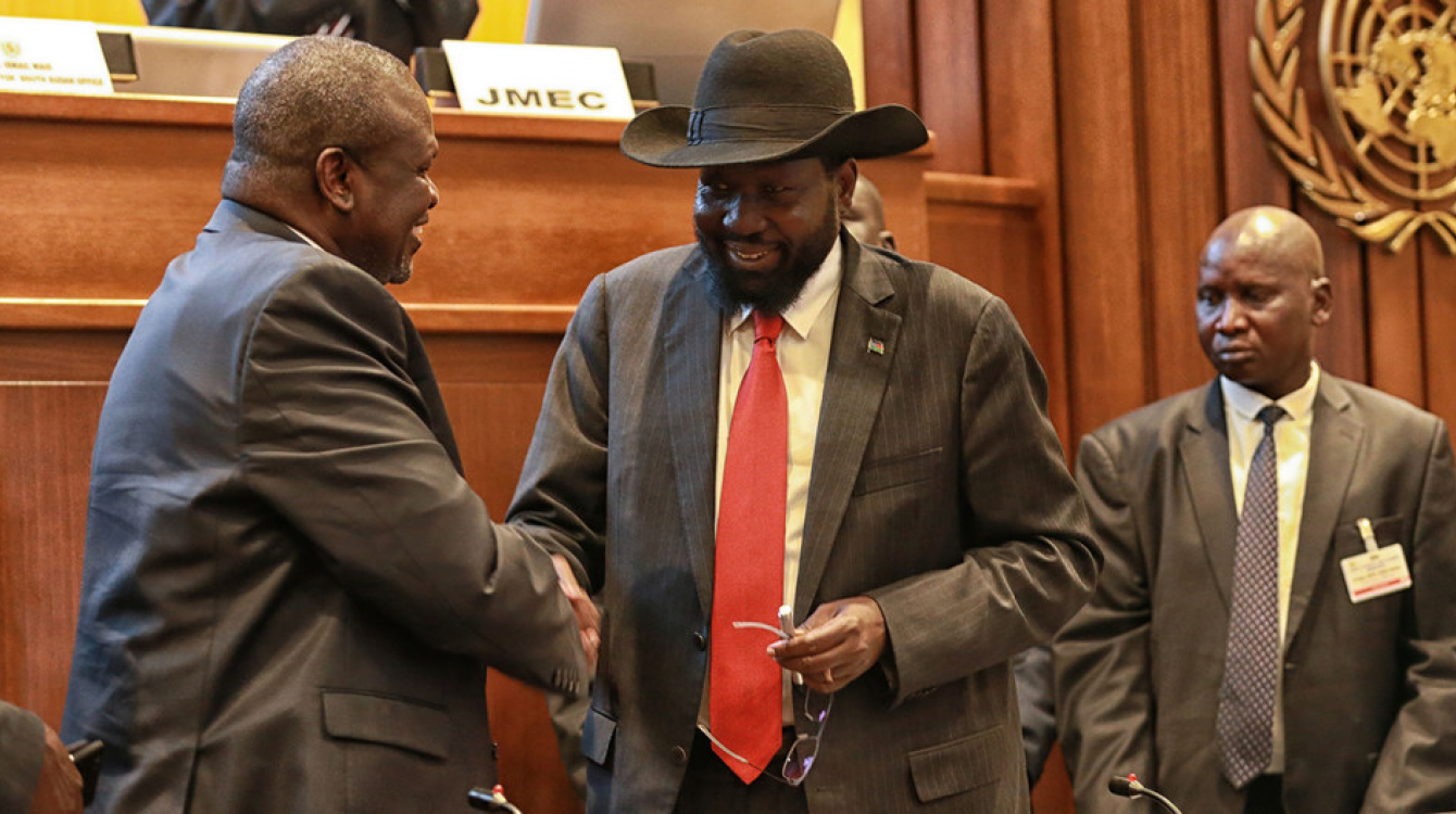 UNMISS/Nektarios Markogiannis. President Salva Kiir (right) of South Sudan shakes hands with leader Riek Machar after concluding a peace deal to end the conflict in the country (September 2018).