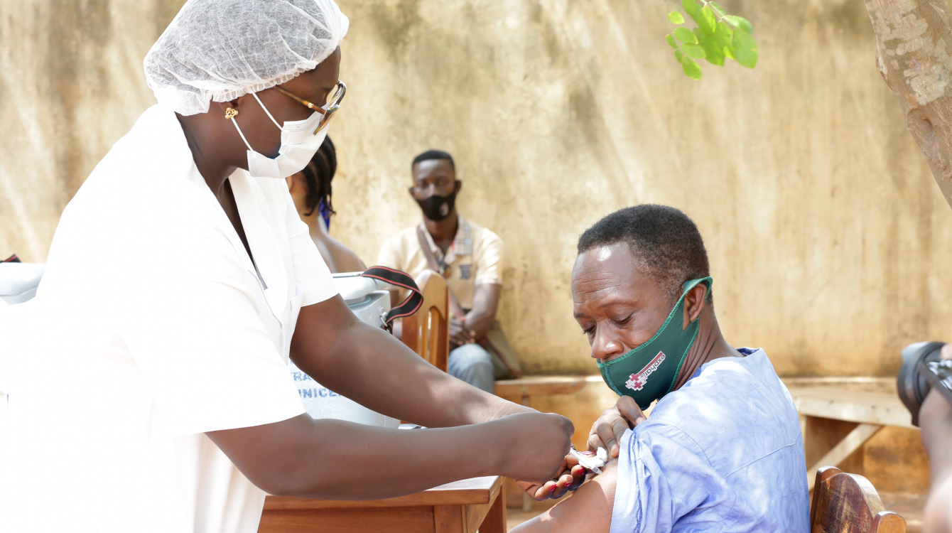 Man receiving COVID-19 vaccine.