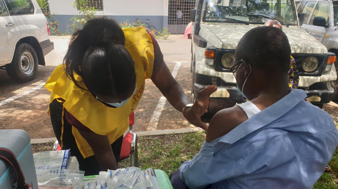 Health worker vaccinating a client in the Kumasi in the Ashanti Region of Ghana
